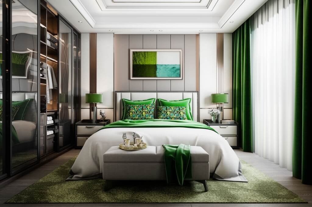 Un tableau aux couleurs vertes rappellant les couleurs de la chambre