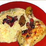 Poulet flambé au cognac sur riz à l'orange Poulet flambé au cognac sur riz à l'orange